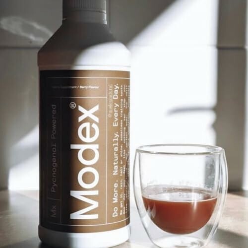 Modex supplement bottle with a glass of liquid